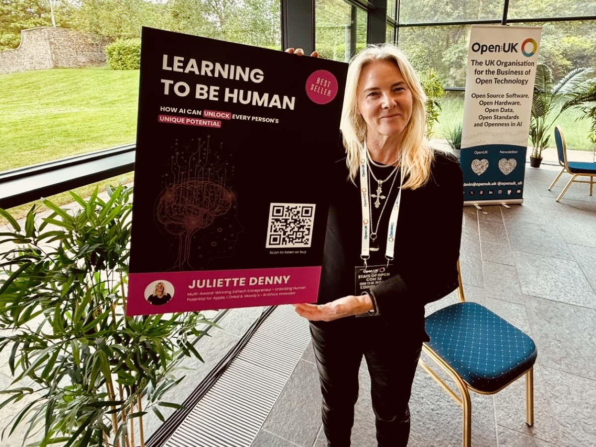 Juliette Denny holding the Learning to be Human poster